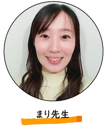 笑顔でこちらを見ているまり先生